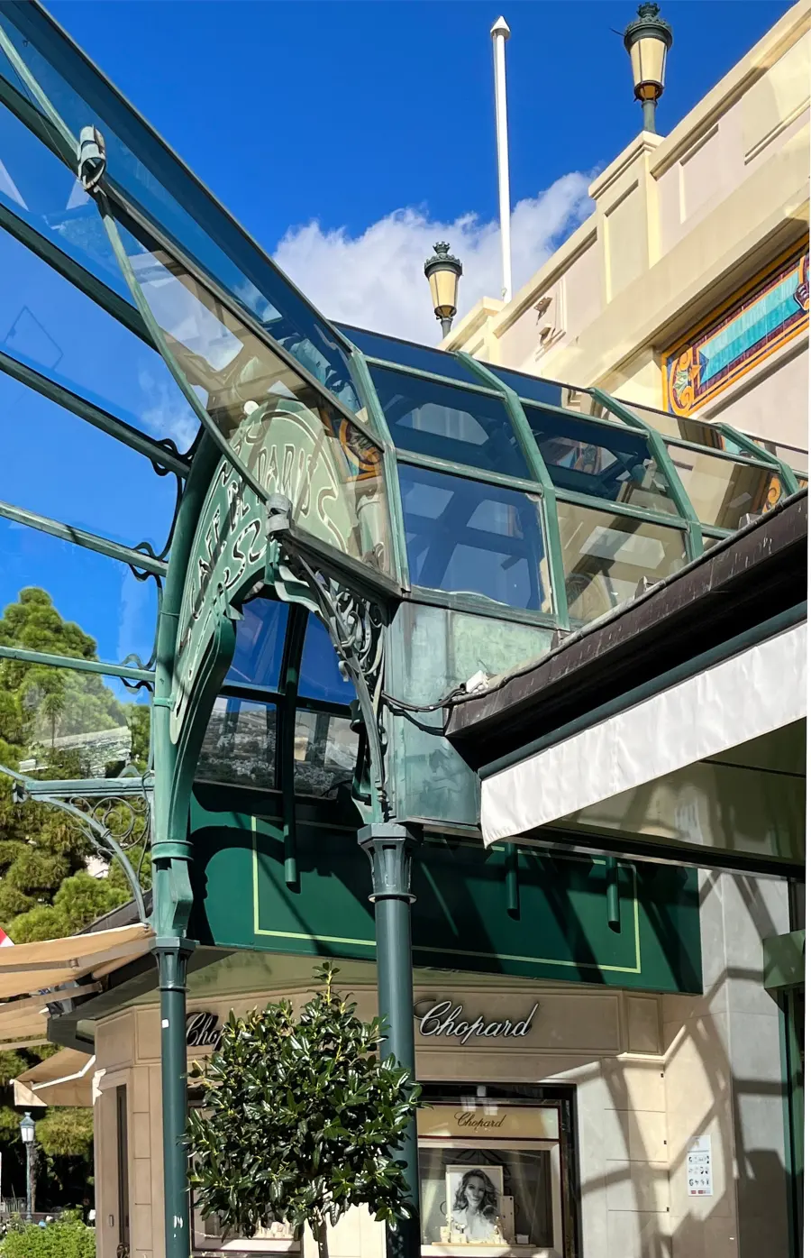 The entrance to the Cafe de Paris in Monte-Carlo, its glazed canopy and lettering above the doors